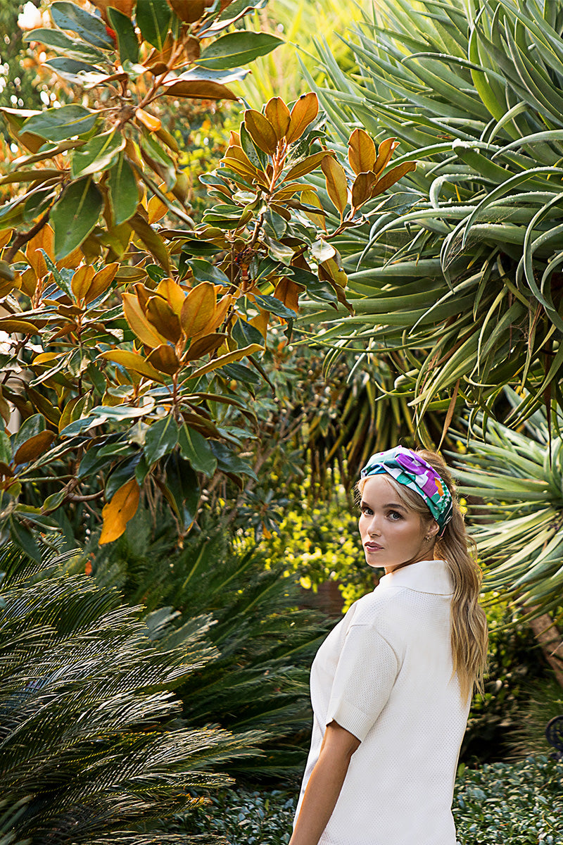 Woman_in_garden_wearing_turban_waterproof_headband_abstract_floral_print