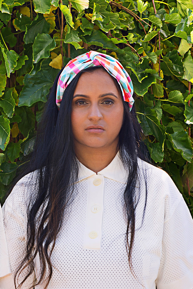 Woman_in_garden_wearing_turban_waterproof_headband_gingham_print