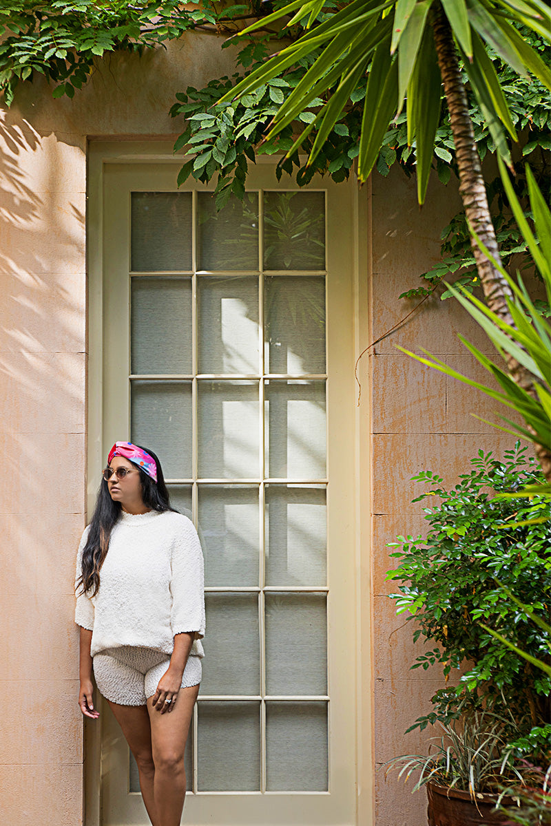Woman_standing_wearing_turban_waterproof_headband_floral_oil_paiting_print
